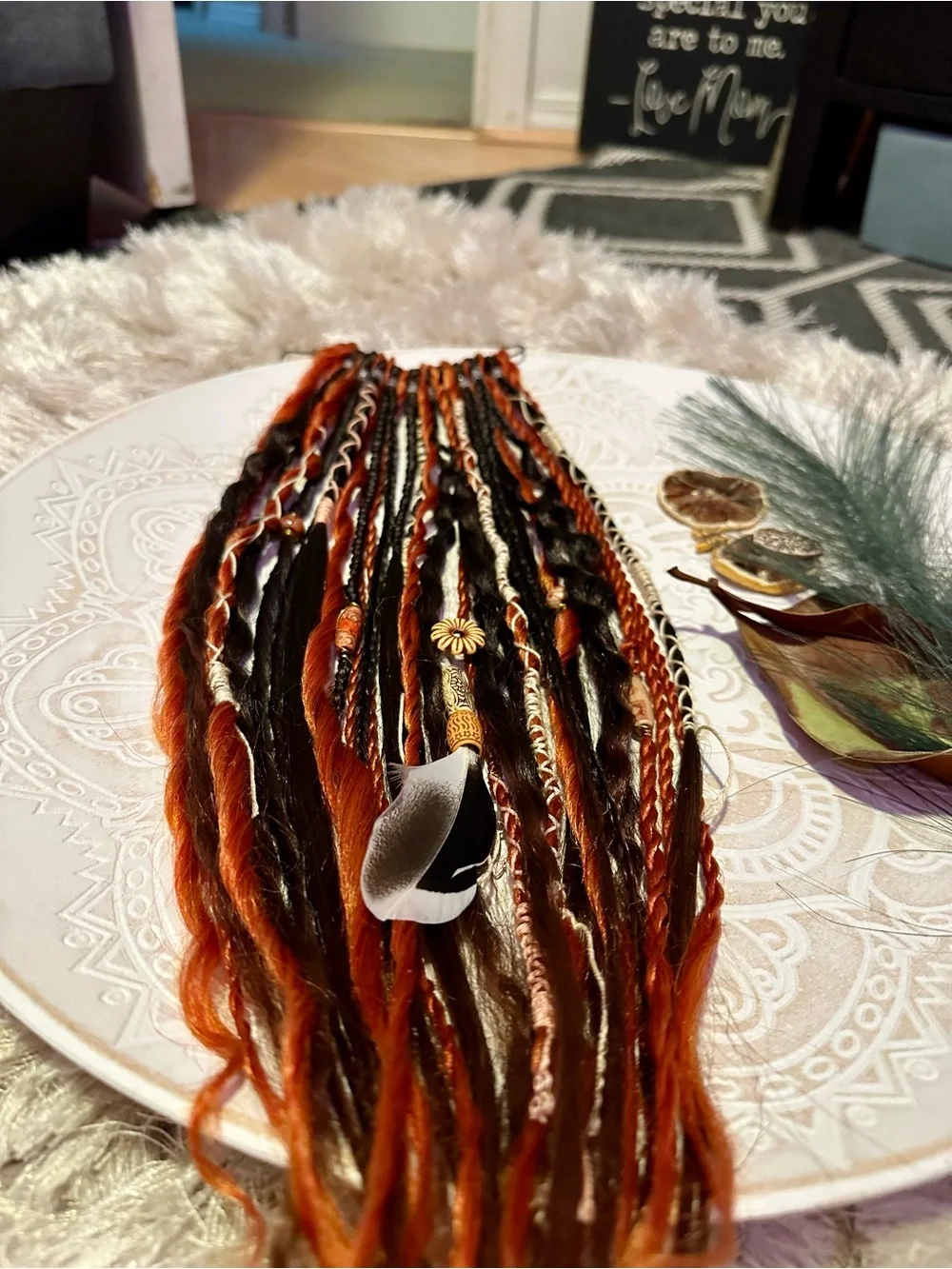 Blonde Hair Extensions with Black and Orange Braided Accents
